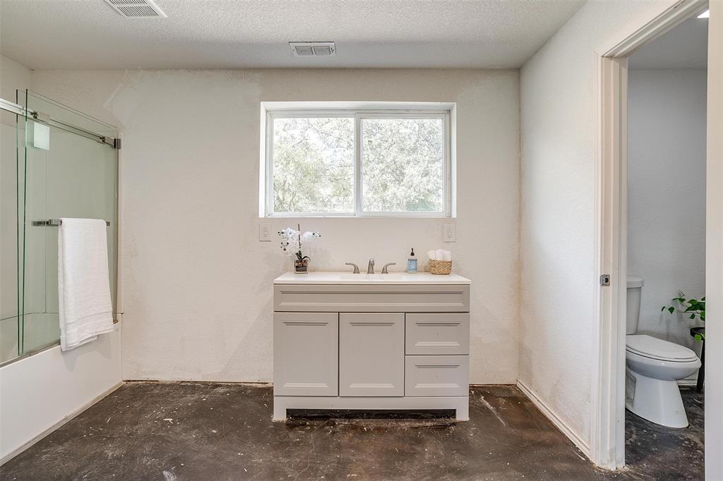 901 Remington Road Santo, TX 76472 - Photo 16 of 40 a bathroom with a sink and a toilet