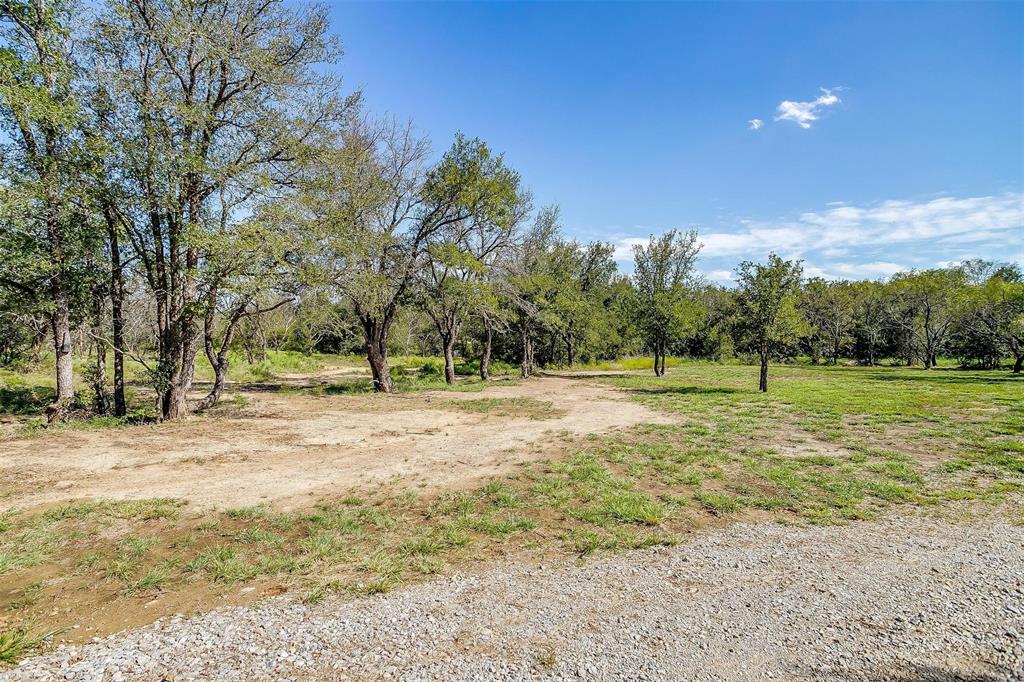 901 Remington Road Santo, TX 76472 - Photo 19 of 40 a view of a field with trees