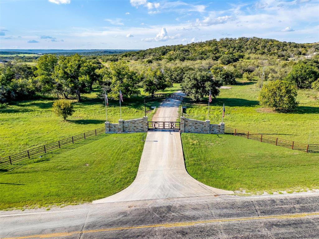 901 Remington Road Santo, TX 76472 - Photo 2 of 40 a view of a swimming pool and an outdoor space