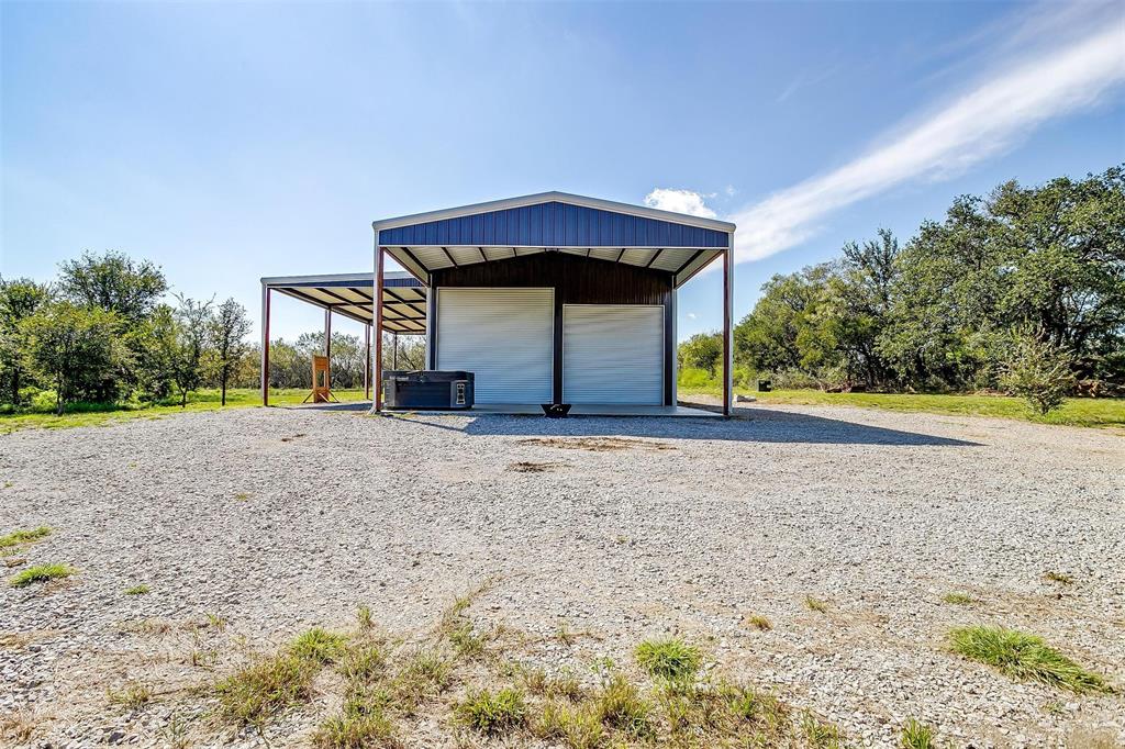 901 Remington Road Santo, TX 76472 - Photo 10 of 40 a front view of a house with a yard