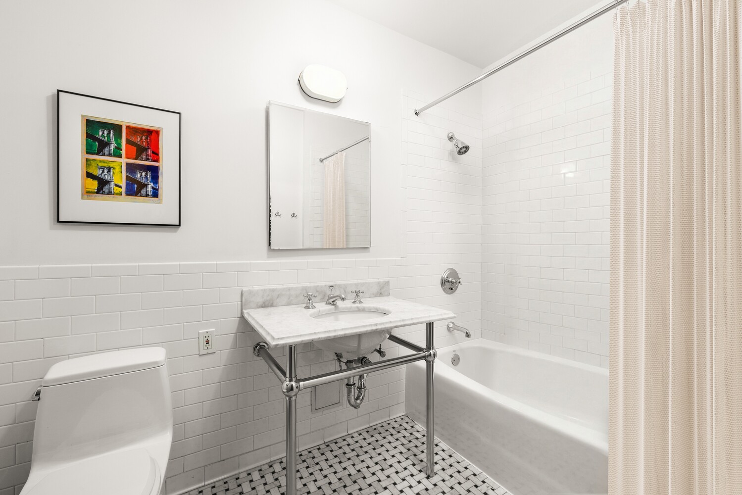 30 Main Street, Unit 3F Brooklyn, NY 11201 - Photo 6 of 12 a bathroom with a toilet a sink and a bathtub