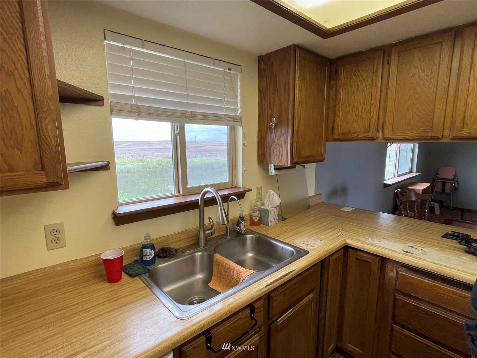 1803 East Tokio Road Ritzville, WA 99169 - Photo 7 of 35 a kitchen with sink cabinets and window