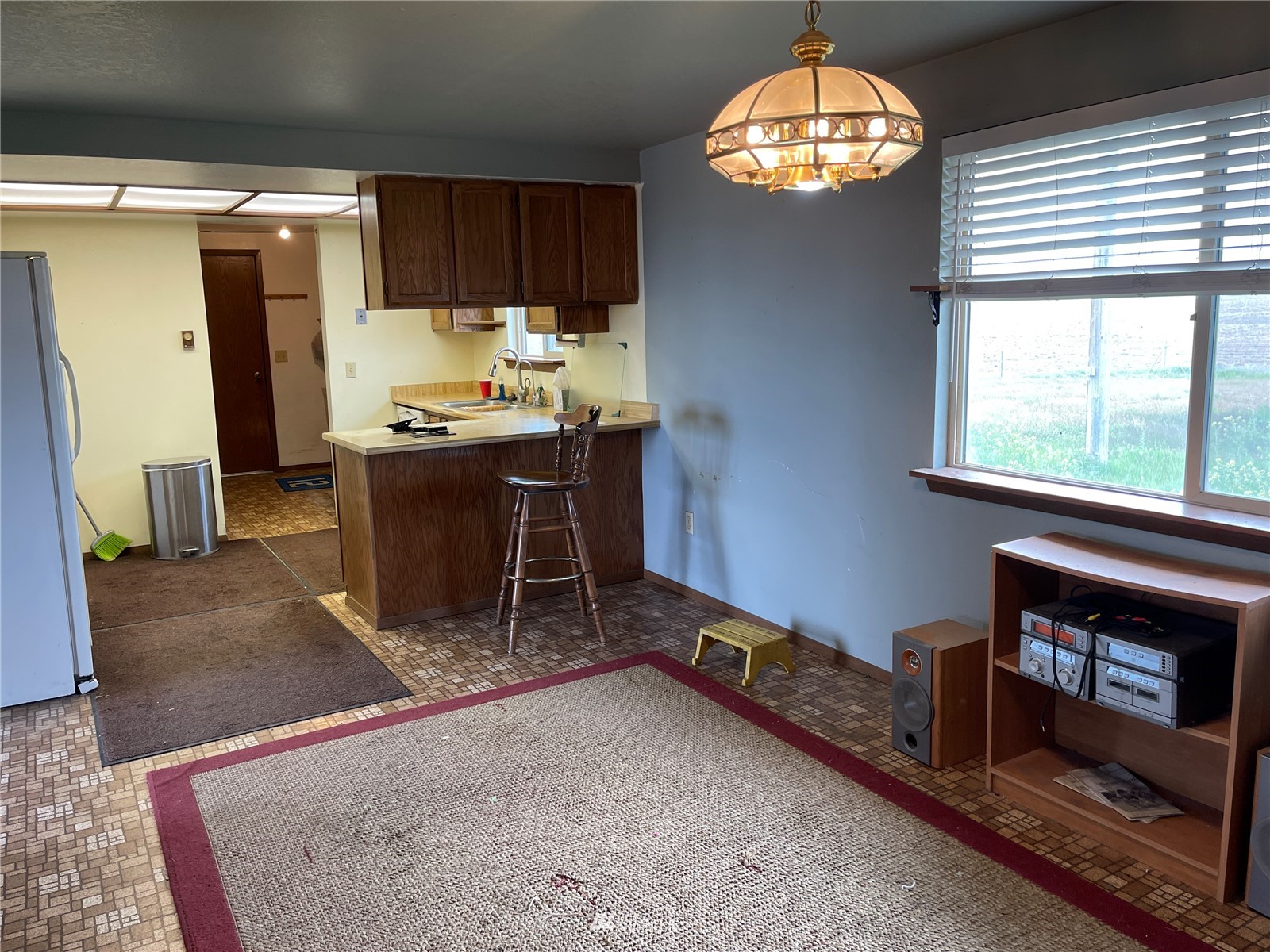 1803 East Tokio Road Ritzville, WA 99169 - Photo 9 of 35 a room with furniture and a chandelier