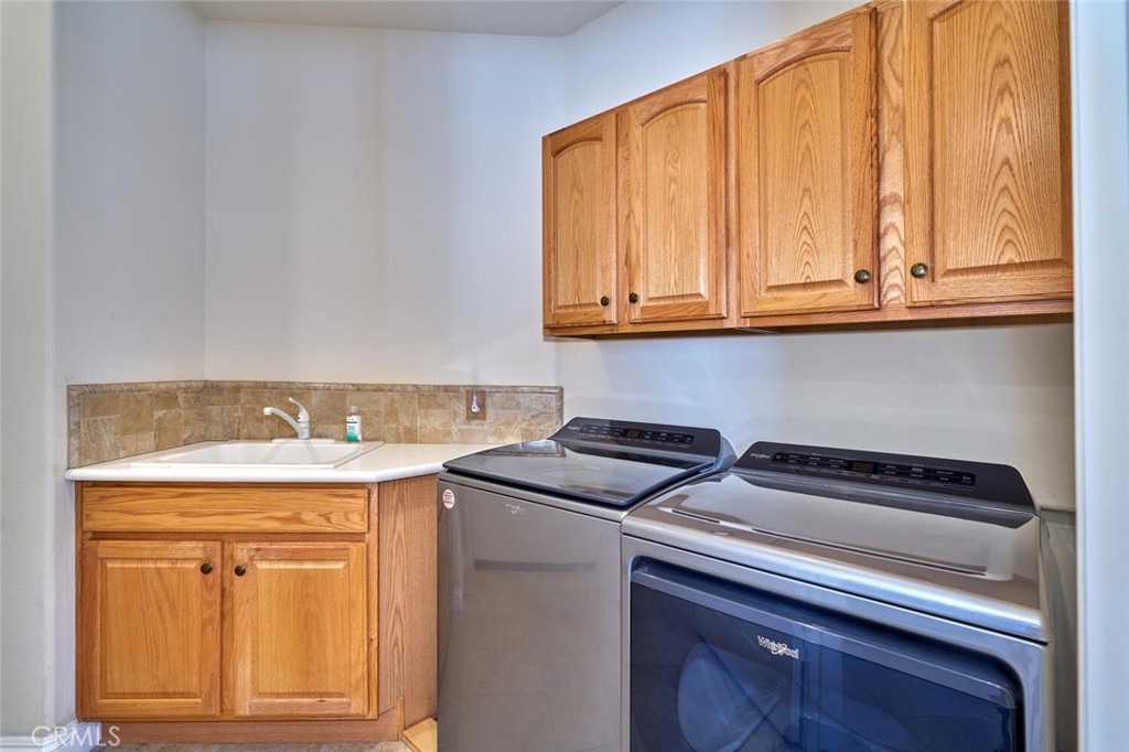 1143 Saguara Road Beaumont, CA 92223 - Photo 42 of 66 a view of a kitchen with appliances and cabinets