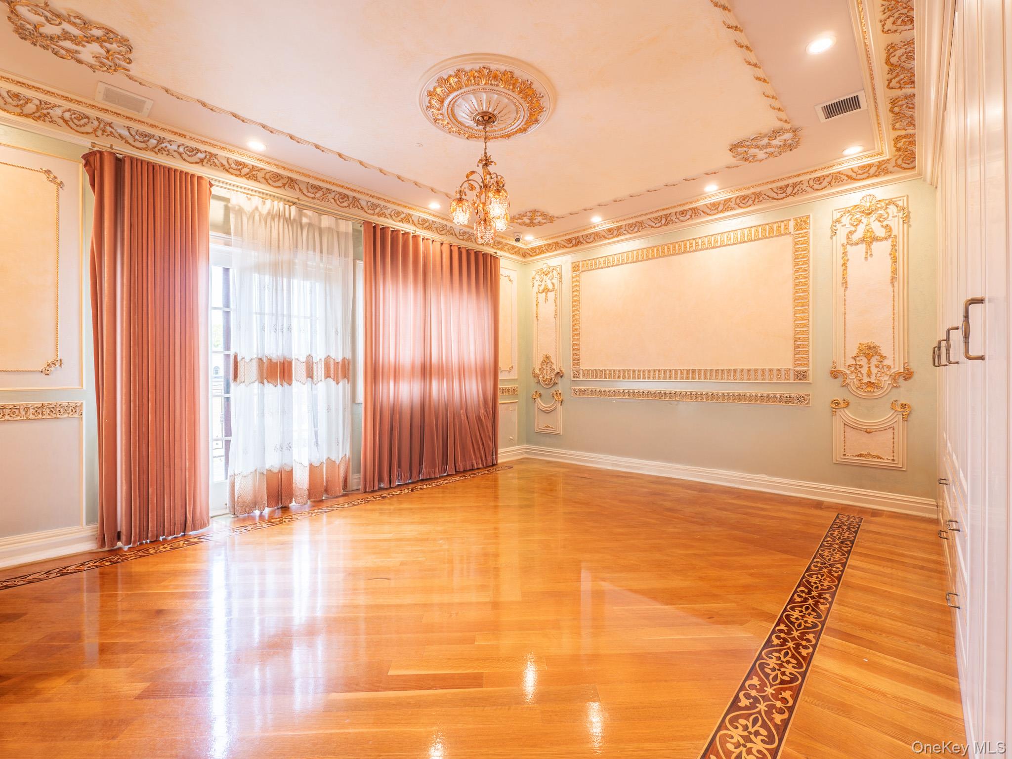 179-15 80th Road Queens, NY 11366 - Photo 16 of 35 a view of an empty room with window and wooden floor