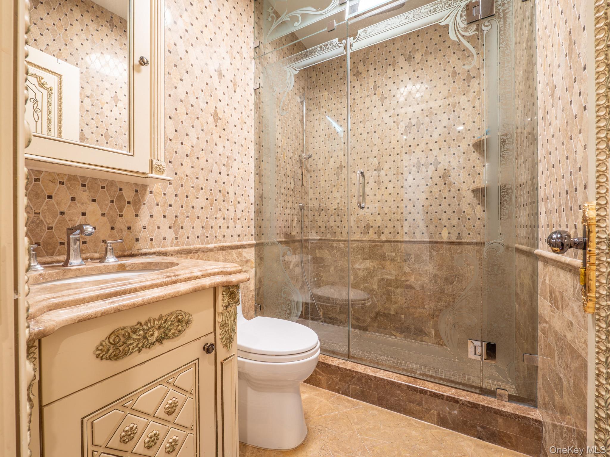 179-15 80th Road Queens, NY 11366 - Photo 17 of 35 a bathroom with a shower a toilet and a sink