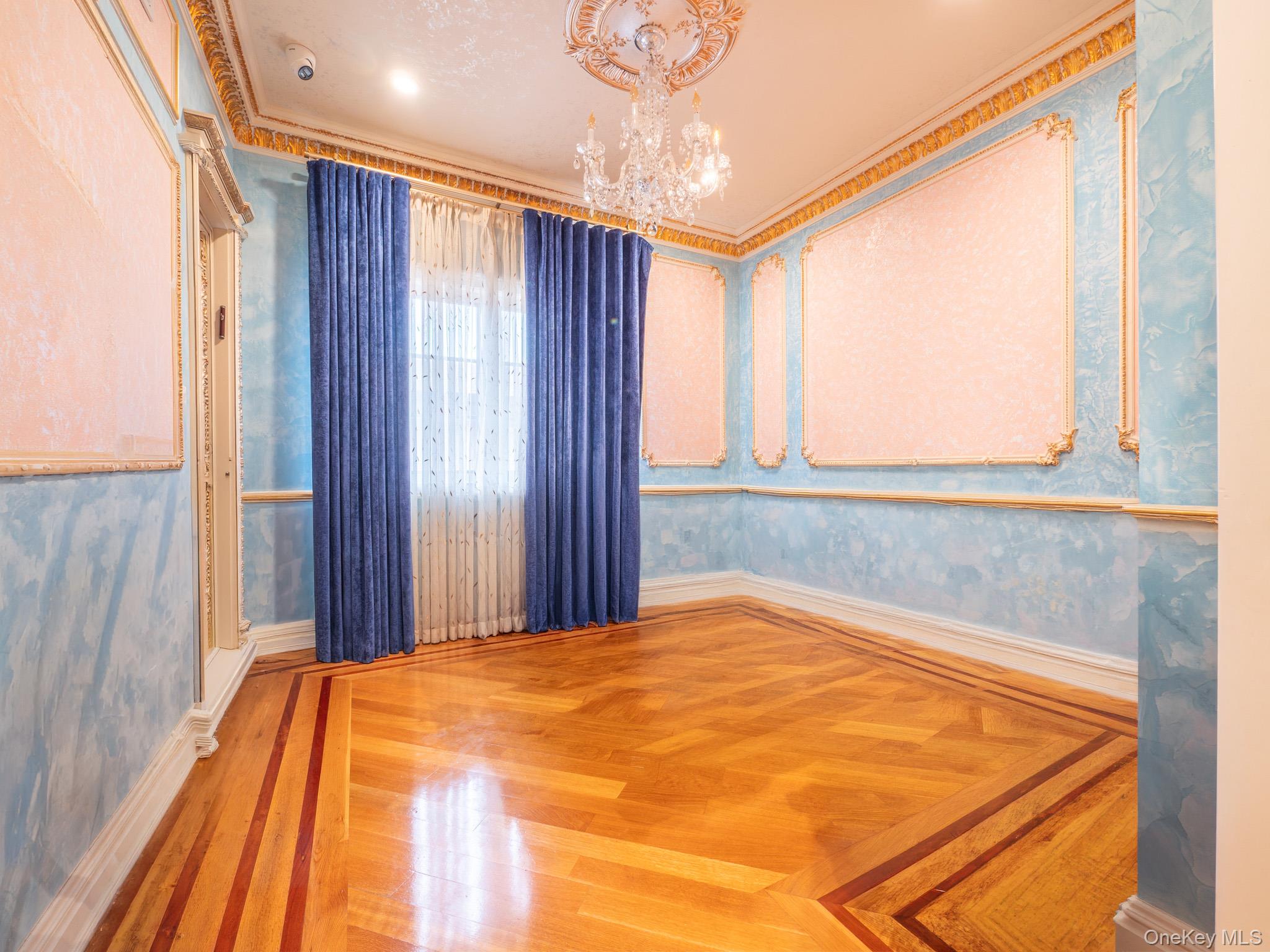 179-15 80th Road Queens, NY 11366 - Photo 18 of 35 a bedroom with a bed and a window