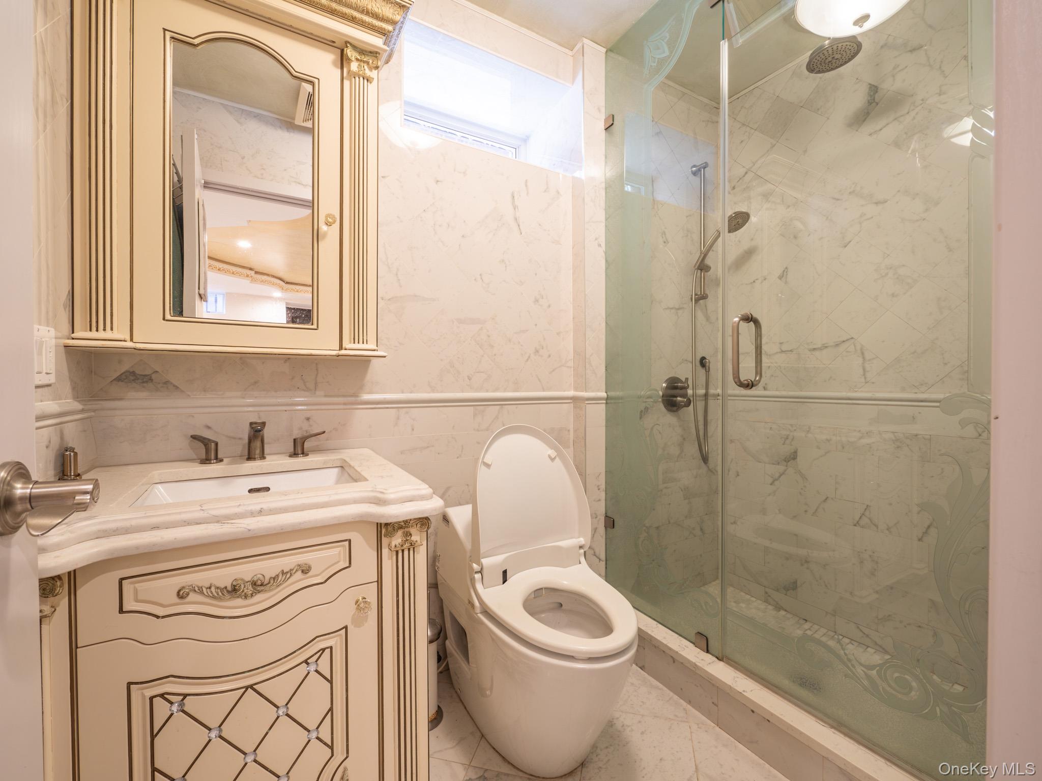 179-15 80th Road Queens, NY 11366 - Photo 26 of 35 a bathroom with a sink a toilet and shower