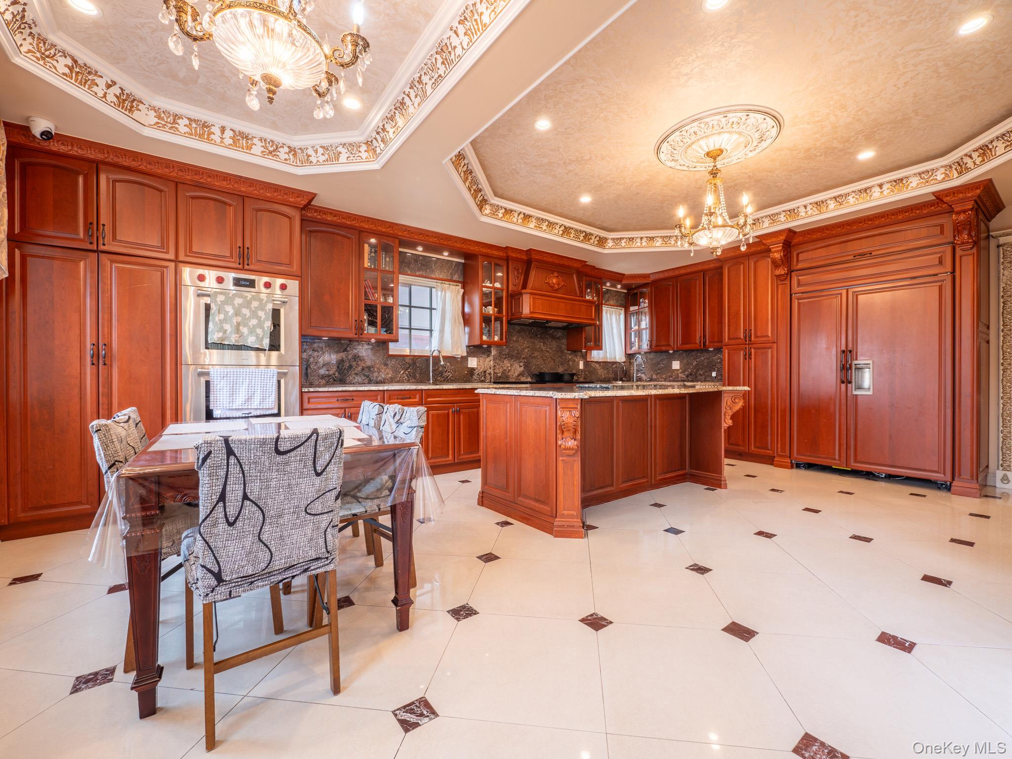 179-15 80th Road Queens, NY 11366 - Photo 6 of 35 a kitchen with stainless steel appliances kitchen island granite countertop a sink and cabinets