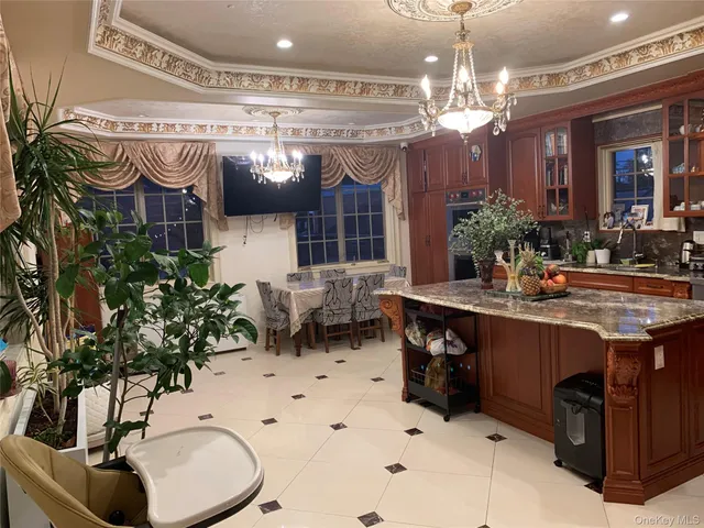 a kitchen with a sink a counter and cabinets