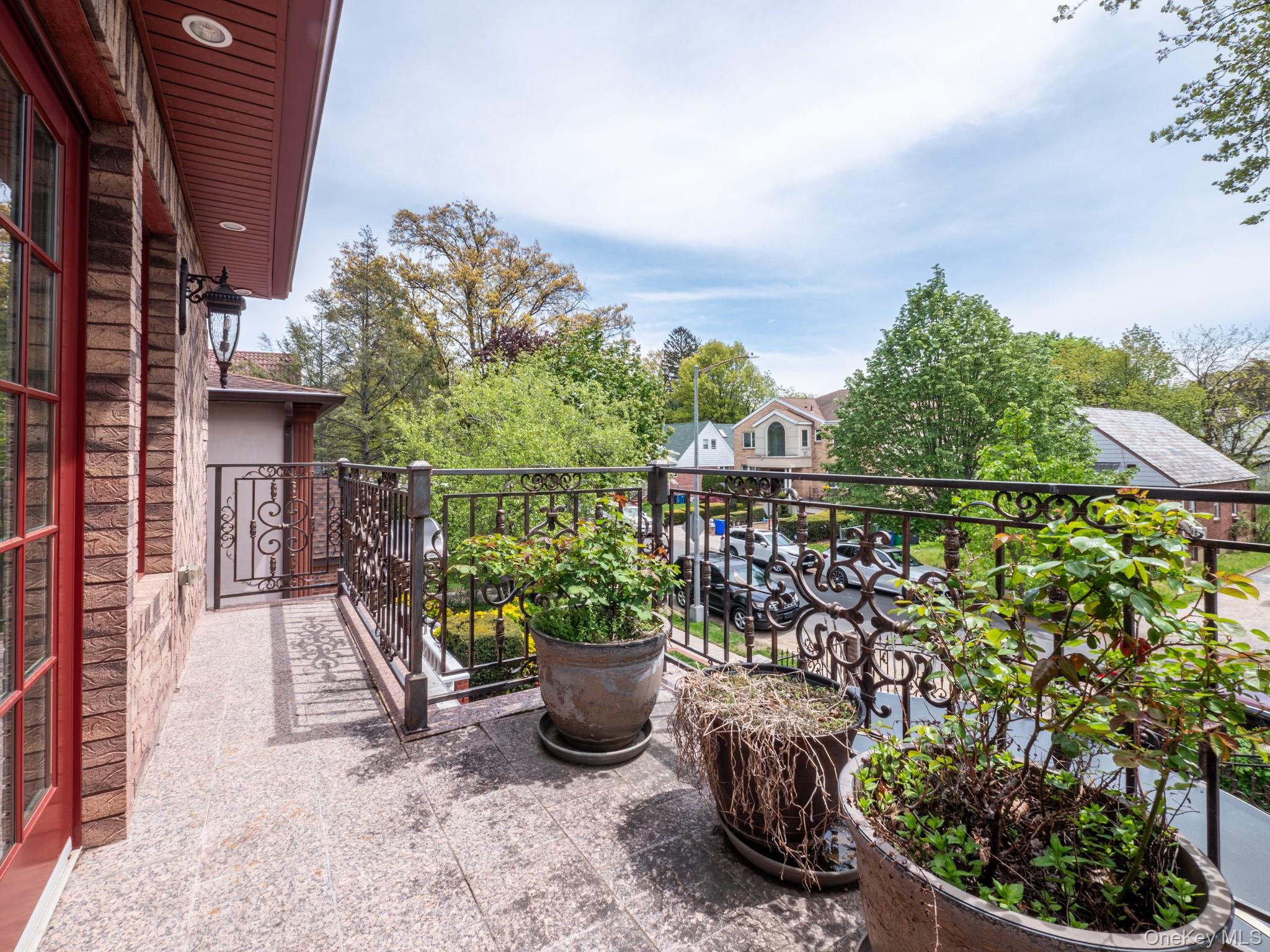 179-15 80th Road Queens, NY 11366 - Photo 9 of 35 a view of a balcony with chair and table