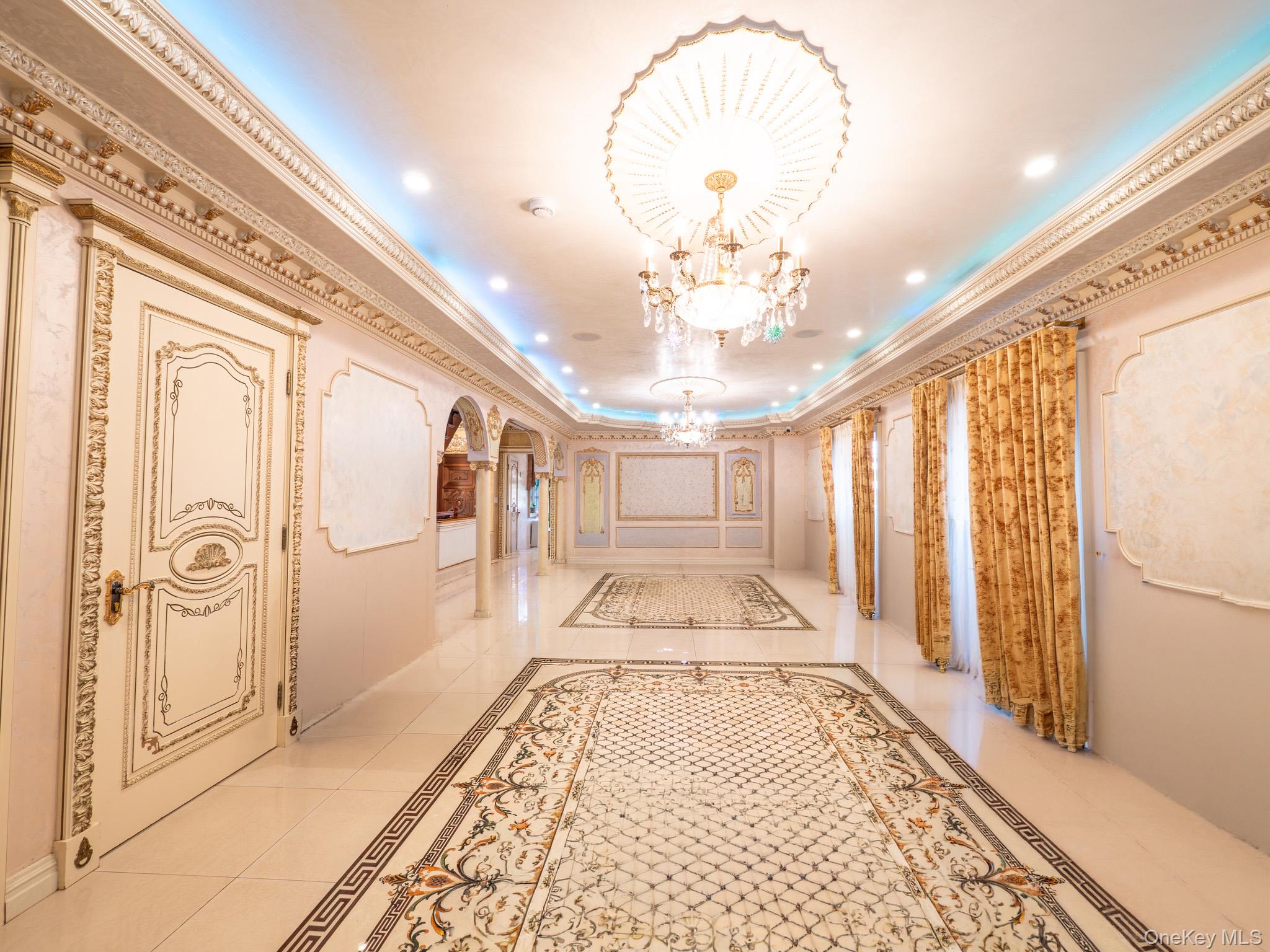 179-15 80th Road Queens, NY 11366 - Photo 10 of 35 a view of a hallway with wooden floor and chandelier