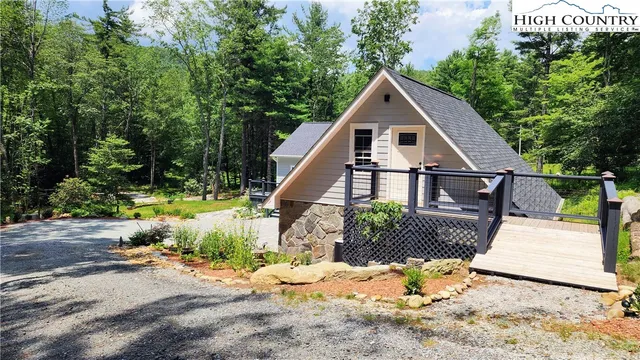 a bedroom with a bed and a mirror