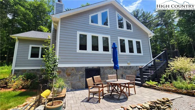 a view of a tree with a yard