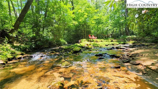 a backyard of a house with outdoor seating