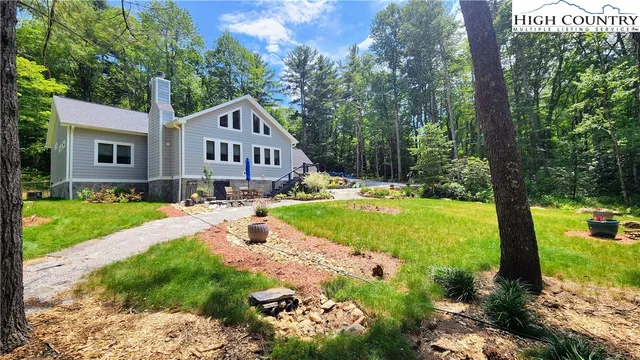 a view of swimming pool and trees in the background