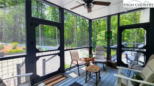 a view of a house with backyard and deck