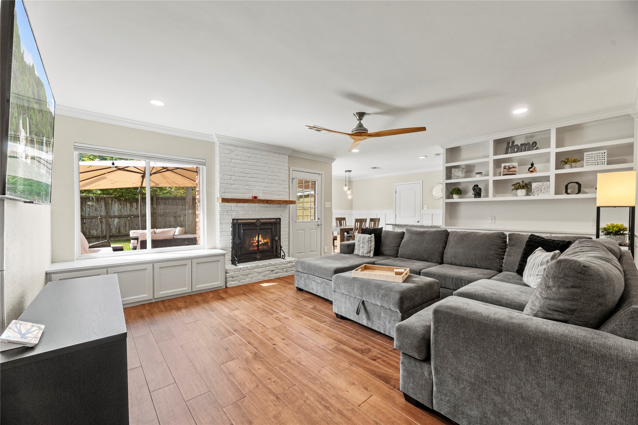6031 McKnight Street Houston, TX 77035 - Photo 11 of 37 a living room with furniture and a fireplace