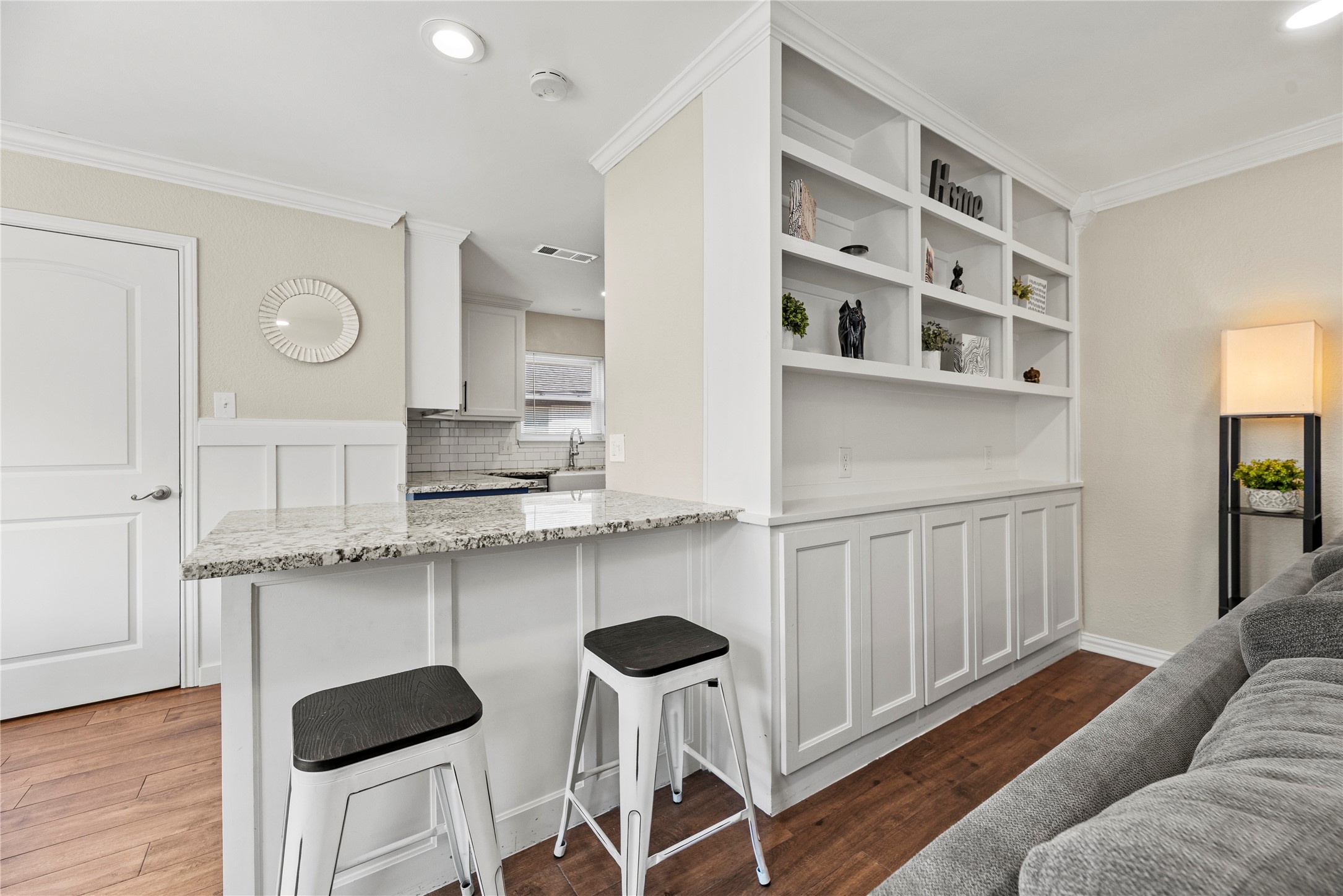 6031 McKnight Street Houston, TX 77035 - Photo 14 of 37 a kitchen with cabinets and chairs