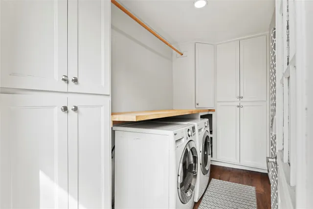 a bed room with a bed and a chandelier