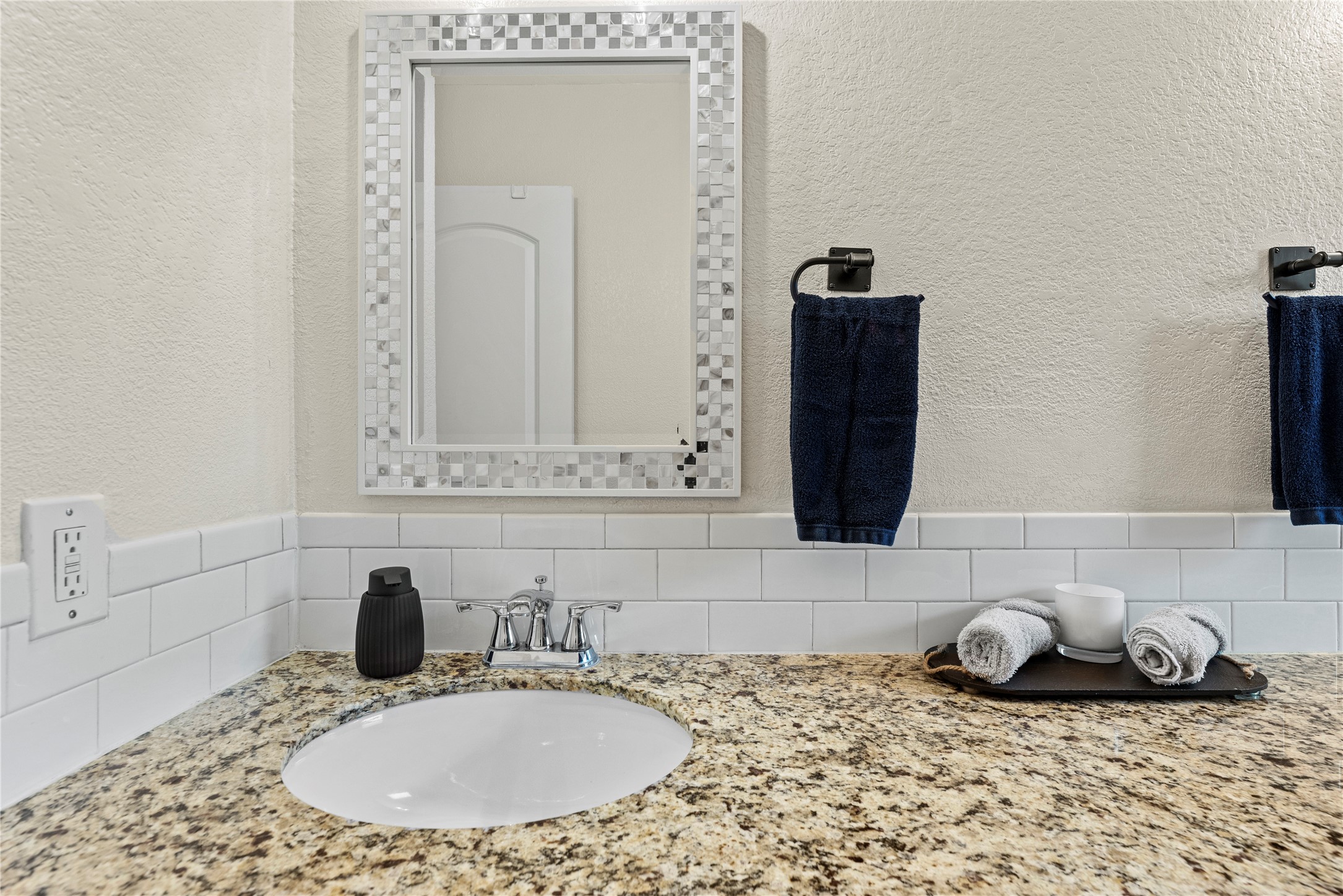 6031 McKnight Street Houston, TX 77035 - Photo 26 of 37 a bathroom with a granite countertop sink and a mirror