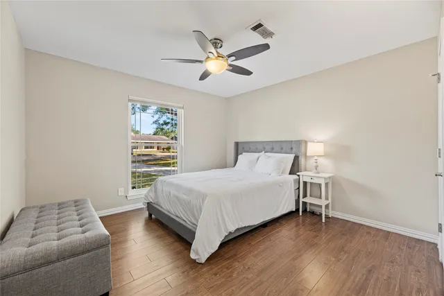 a bedroom with a bed and a table