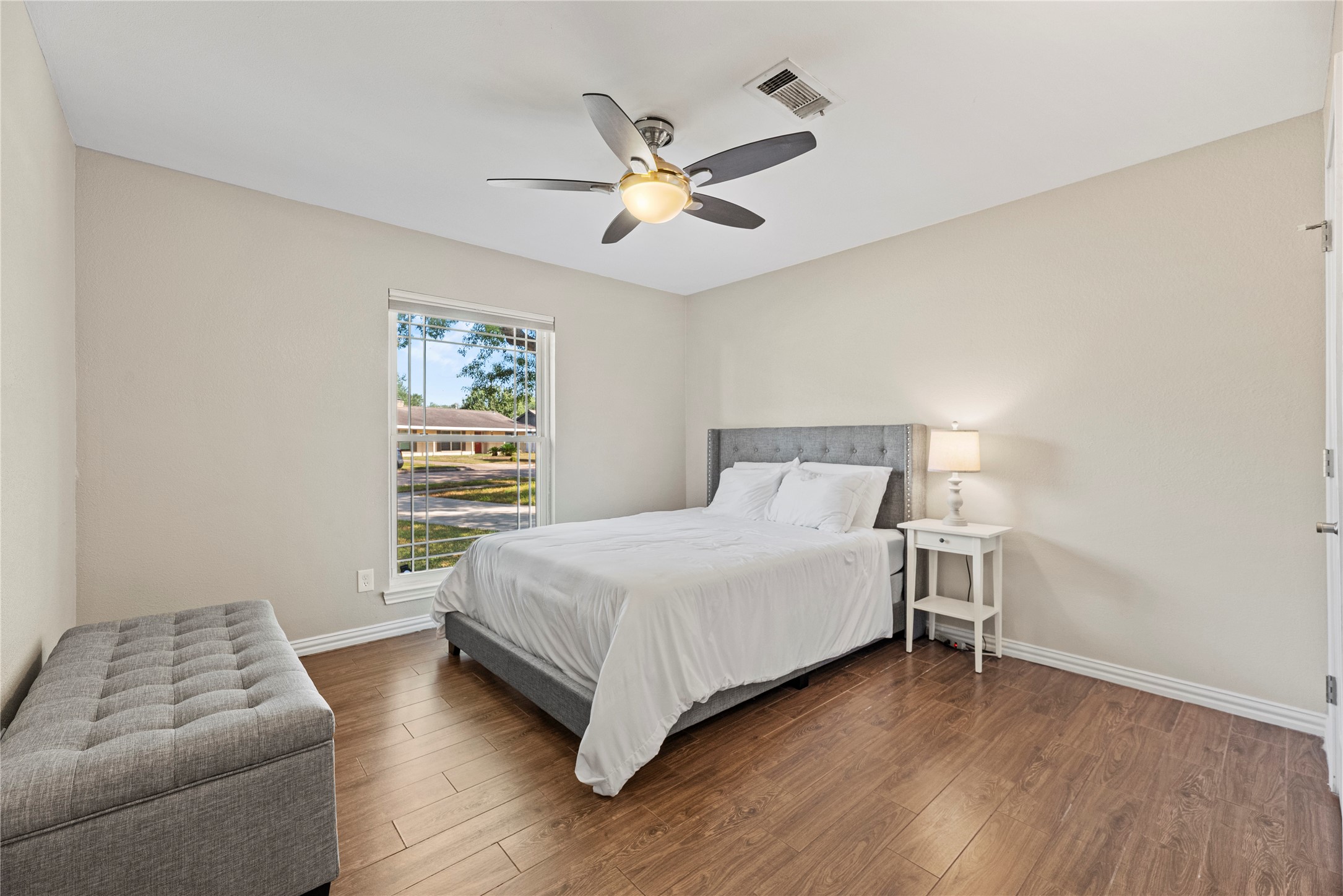 6031 McKnight Street Houston, TX 77035 - Photo 28 of 37 a bedroom with a bed and a couch