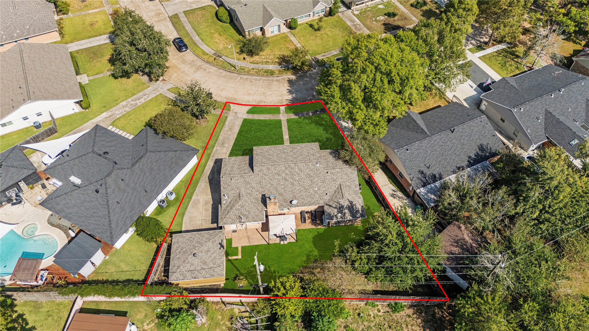 6031 McKnight Street Houston, TX 77035 - Photo 34 of 37 an aerial view of a house with a yard and swimming pool