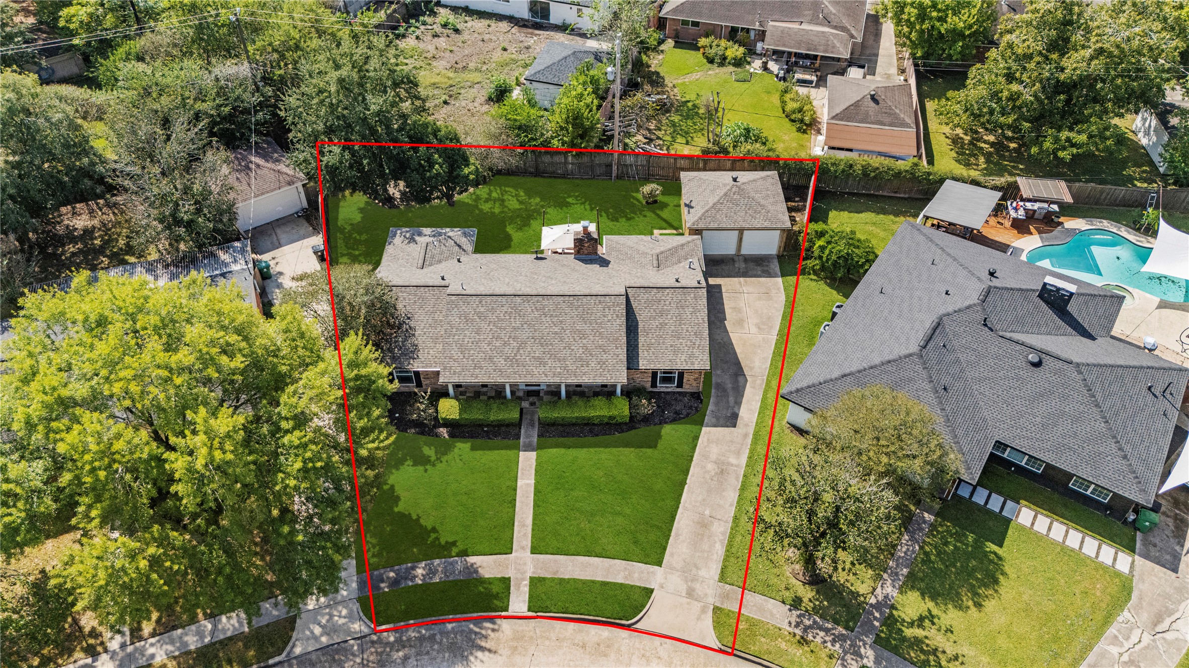 6031 McKnight Street Houston, TX 77035 - Photo 35 of 37 an aerial view of a house with a garden and trees