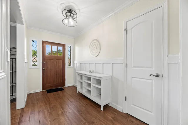 a view of a room with wooden floor