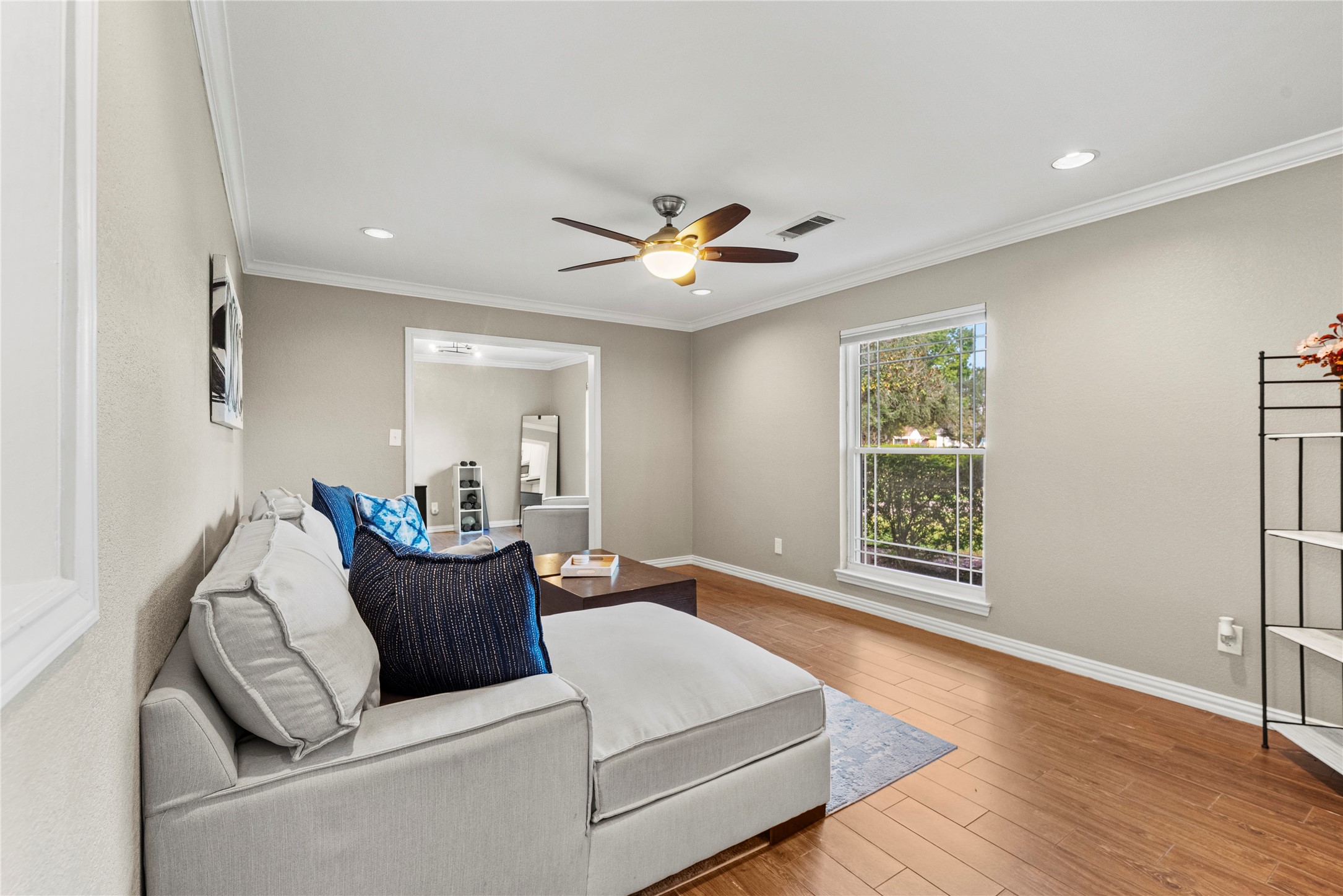 6031 McKnight Street Houston, TX 77035 - Photo 9 of 37 a living room with furniture and a window