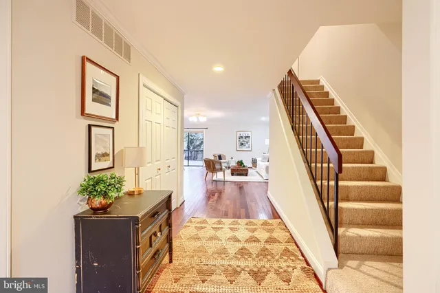 a living room with furniture and a rug