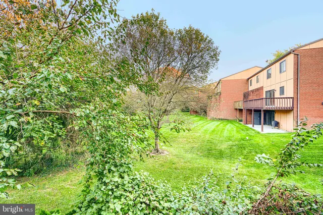 a bedroom with a large bed and a couch