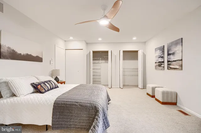 a bedroom with a large bed and a window