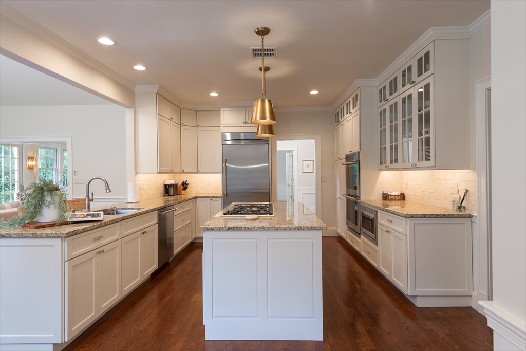 46 Concord Road Weston, MA 02493 - Photo 12 of 42 a kitchen with a sink stove and refrigerator