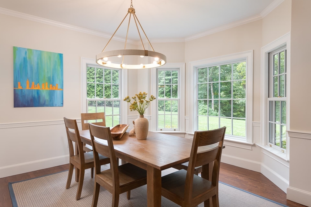 46 Concord Road Weston, MA 02493 - Photo 14 of 42 a view of a dining room with furniture wooden floor and chandelier