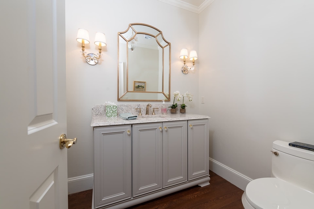 46 Concord Road Weston, MA 02493 - Photo 18 of 42 a bathroom with a granite countertop toilet sink and mirror