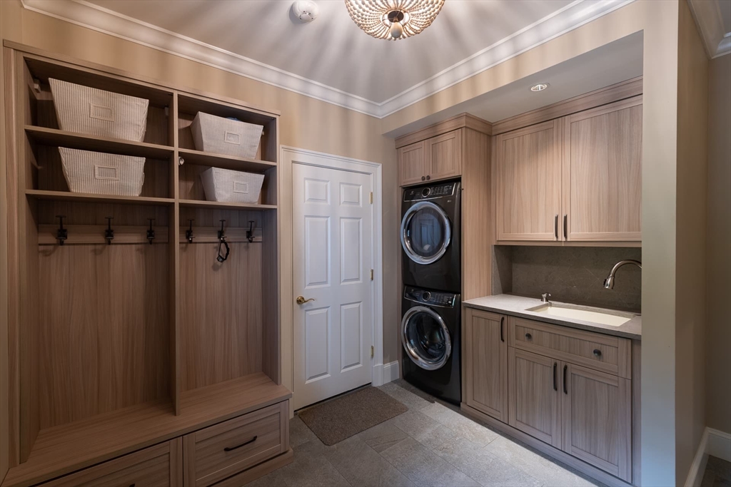 46 Concord Road Weston, MA 02493 - Photo 19 of 42 a utility room with dryer and washer