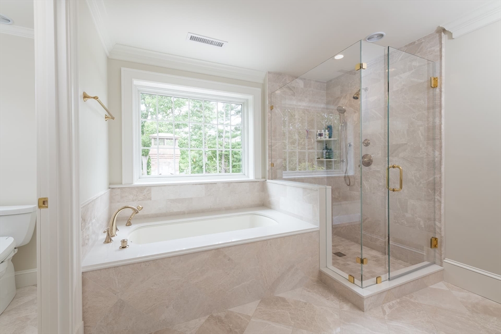 46 Concord Road Weston, MA 02493 - Photo 22 of 42 a spacious bathroom with a bathtub and shower