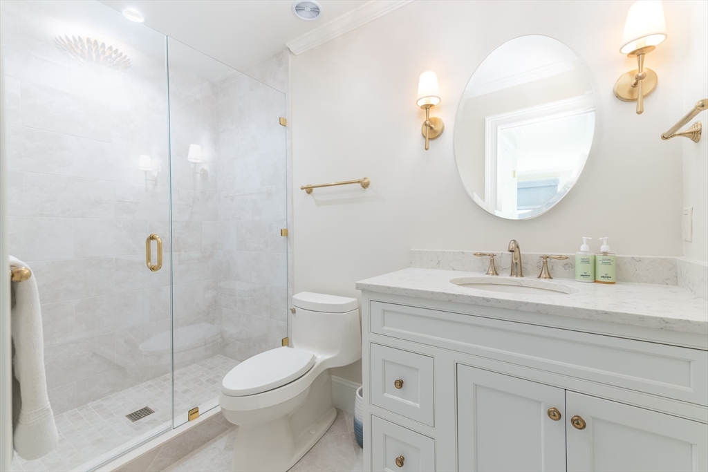 46 Concord Road Weston, MA 02493 - Photo 31 of 42 a bathroom with a sink a toilet and shower