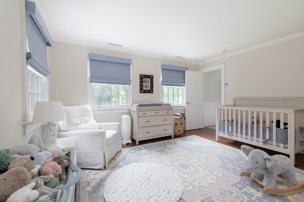 46 Concord Road Weston, MA 02493 - Photo 32 of 42 a bedroom with furniture and a window