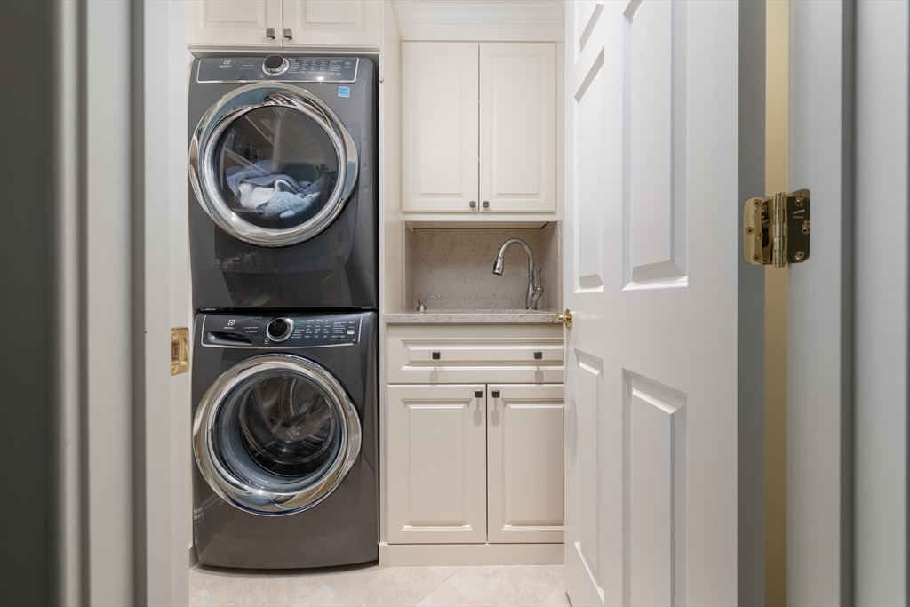 46 Concord Road Weston, MA 02493 - Photo 33 of 42 a utility room with dryer and washer