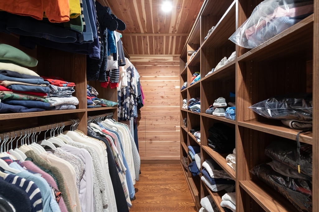 46 Concord Road Weston, MA 02493 - Photo 36 of 42 a view of walk in closet with clothes and shoes