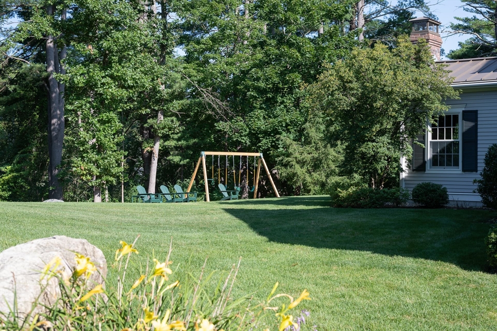 46 Concord Road Weston, MA 02493 - Photo 40 of 42 a view of a backyard with large trees