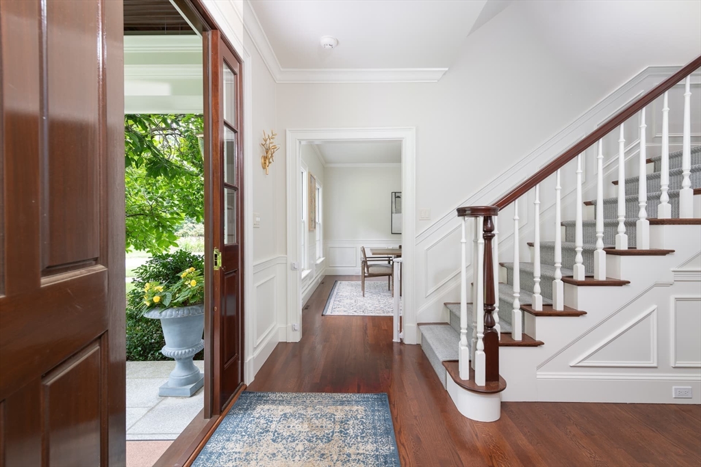 46 Concord Road Weston, MA 02493 - Photo 4 of 42 a view of entryway with wooden floor and stairs
