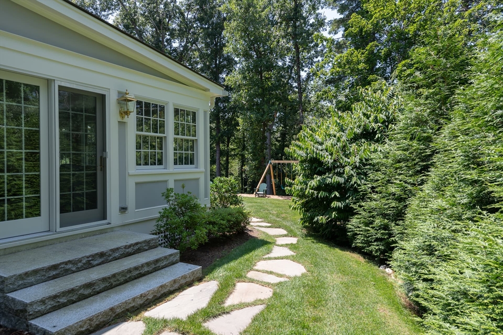 46 Concord Road Weston, MA 02493 - Photo 41 of 42 a view of a house with a yard