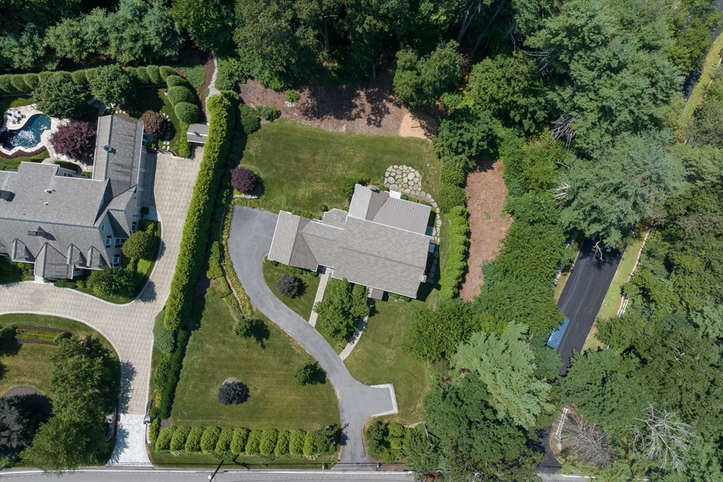 46 Concord Road Weston, MA 02493 - Photo 42 of 42 an aerial view of a house with outdoor space and a lake view