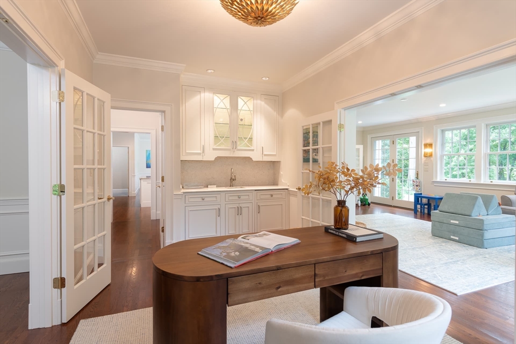 46 Concord Road Weston, MA 02493 - Photo 7 of 42 a kitchen with a table chairs and refrigerator