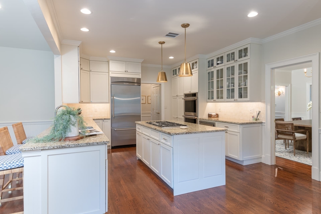 46 Concord Road Weston, MA 02493 - Photo 9 of 42 a kitchen with kitchen island a stove a sink and a refrigerator