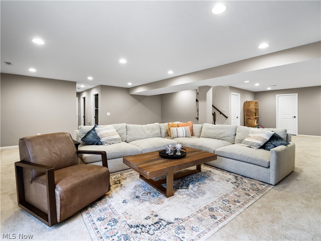 8898 Harvest Ridge Way North Ridgeville, OH 44039 - Photo 29 of 41 Carpeted living area featuring recessed lighting and stairs